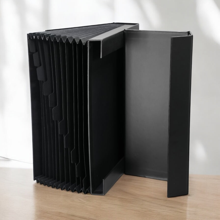 Expanding file box with top magnetic closure.