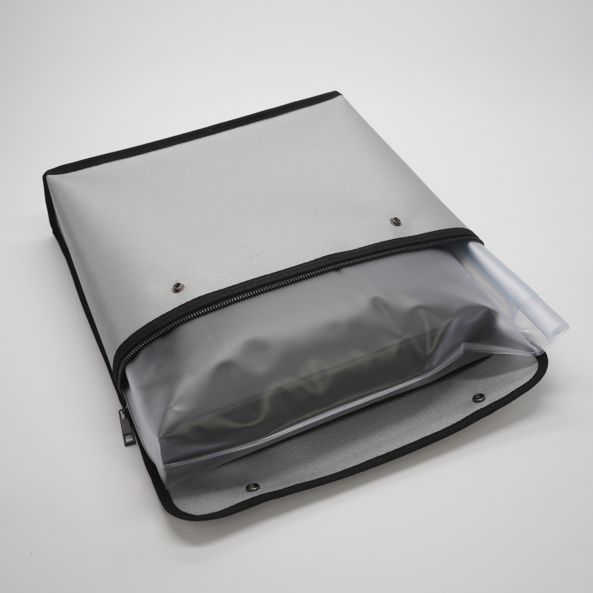 Top zipper opening creating a secure pouch to store document storage box inside a water proof bag.